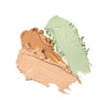 Close-up of make-up swatches. Smears of beige and green skincare beauty product concealer or foundation