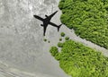 Shadow airplane flying above mangrove forest. Sustainable fuel. Biofuel in aviation. Sustainable transportation and eco-friendly Royalty Free Stock Photo