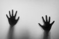 Shadow blur hands of the Man behind frosted glass. Blurry hand ab Royalty Free Stock Photo
