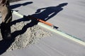 Shadow of builders working together on leveling cement Royalty Free Stock Photo