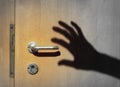 Shadow of a burglar breaking into a house Royalty Free Stock Photo