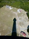 The shadow of Cape Hatteras Lighthouse over the keepers house. Buxton, NC, USA, October 2, 2019. Royalty Free Stock Photo