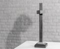 Shadow of a christian man praying to wooden cross on table. Jesus Christ Christianity concept. In black and white tone Royalty Free Stock Photo