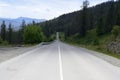 The shadow of a cloud on a mountain road in the Altai Mountains in summer Royalty Free Stock Photo