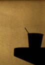 Shadow of a coffee paper cup on a table Royalty Free Stock Photo