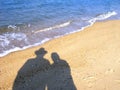 Shadow of couple on beach Royalty Free Stock Photo