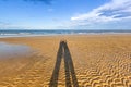 Shadow of couple on beach Royalty Free Stock Photo