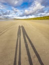 Shadow of couple enjoying the beach Royalty Free Stock Photo