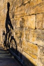 Shadow of cyclist on a wall