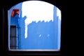 Shadow detail by a window with a blue wall Royalty Free Stock Photo