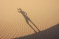 Shadow in dunes drinking man Royalty Free Stock Photo