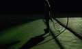 Shadow Of Female Player Holding Tennis Racket On Green Tennis Court. Generative AI