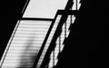 Shadow of fire escape stair on cement wall. Royalty Free Stock Photo