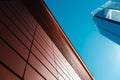 Shadow forms clean gradient on red tiles and tall buildings with clear sky Royalty Free Stock Photo