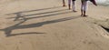 Shadow of four ladies standing.