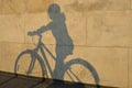 Shadow of girl on bicycle