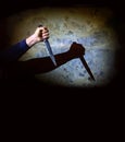 Shadow of the hand holding a big knife Royalty Free Stock Photo