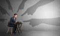Shadow hands pointing at a small worker Royalty Free Stock Photo