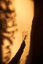 Shadow of hand turning off light switch Royalty Free Stock Photo