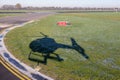 Shadow from helicopter at runway Dutch Airport Zestienhoven near Rotterdam