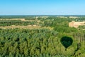 The shadow of a balloon flying over a deciduous forest Royalty Free Stock Photo