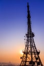 Shadow image of Korea tower on blue sky background with sparkling orange light in twilight time