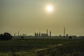 Shadow of industrail factory plant with green fields Royalty Free Stock Photo