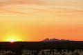 Shadow of Kata Tjutas Olgas at sunset. Picture approved by Uluru Media office