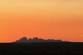 Shadow of Kata Tjutas Olgas at sunset. Picture approved by Uluru Media office