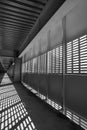 Shadow and light. Black and white. Sunny day light from metal lattice in abandoned unfinished shoping mall