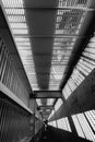 Shadow and light. Black and white. Sunny day light from metal lattice in abandoned unfinished shoping mall