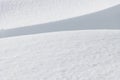 Curved shadow on sunlit fresh white winter snow surface Royalty Free Stock Photo