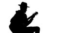 Shadow of male guitar player performing music at concert, art leisure, talent Royalty Free Stock Photo