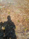 Shadow of a man against the background of a shallow mountain river