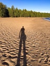 Shadow of man on the beach in Valaam island, Ladoga lake, Karelia