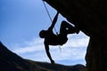 The shadow of a man climbing in the mountains