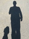 Shadow of a man with dog Royalty Free Stock Photo