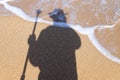 Shadow of a man by the sea Royalty Free Stock Photo