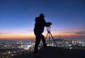 Shadow Man Standing Silhouette on background of Sunrise Sky and Photographer with a camera mounted on tripod in Seoul South Korea Royalty Free Stock Photo