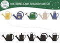 Shadow matching activity for children with watering cans. Preschool puzzle with garden tools. Cute spring educational riddle. Find