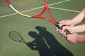 Shadow of mother and daughter playing tennis