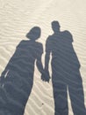 Shadow of a pair of lovers on the beach