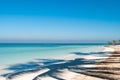 Shadow of palm on the beach of Cayo Jutias in Cuba. Boat and blu