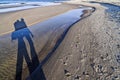 Shadow of people walking on a beach by the Baltic sea Royalty Free Stock Photo