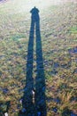 Shadow of a person on a meadow Royalty Free Stock Photo