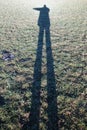 Shadow of a person on a meadow Royalty Free Stock Photo