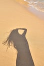 shadow from the photographer girl in the sand, silhouette in the sand