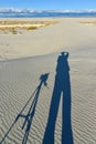 Shadow of a photographer on a gypsum dune in White Sands National Monument in New Mexico, USA Royalty Free Stock Photo