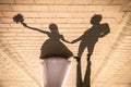 Shadow of posing wedding couple on ground Royalty Free Stock Photo