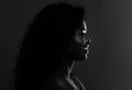 In The Shadow. Profile Of Black Attractive Female Over Dark Background, BW